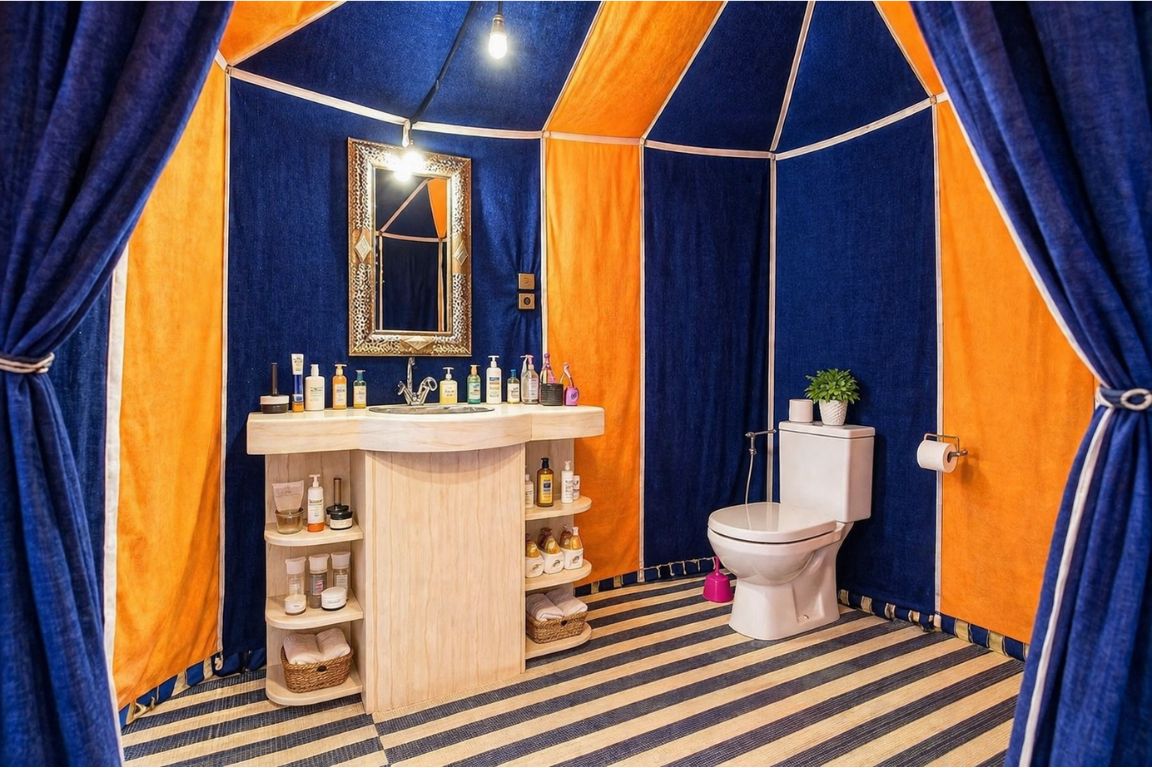 Private ensuite bathroom setup inside a desert tent with amenities and toiletries during a Marrakech Desert Tours stay with our agency